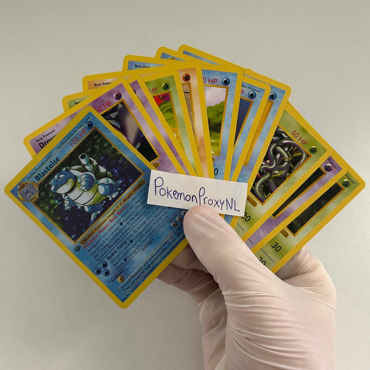 Booster box/packs: Base Set (first edition) (BS) / PROXY Pokémon TCG card(s)